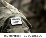 Inscription Private Army on military uniform. Inscription Private Army on soldier arm. Private military