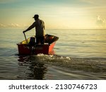 Silhouette Of A Fishermen On...