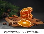 Composition of dry oranges, cinnamon sticks and star anise. Christmas composition.