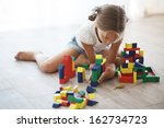 Child Playing With Blocks At...