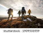 Group of four hikers with...