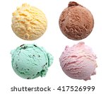 Four ice cream scoops isolated on a white background including vanilla, chocolate, mint and strawberry