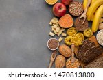 Assortment of food rich on fiber and carbohydrates on gray background with copy space