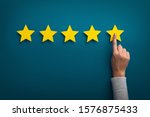 Customer Experience Concept. Woman hand showing on five star excellent rating on background, copy space