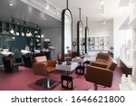 Stylish beauty salon interior. Hairdresser and makeup artist workplaces in one room, creative mirrors
