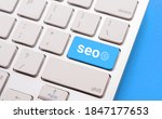 stock-photo-closeup-of-computer-keyboard-with-word-seo-on-blue-background-search-engine-optimization-for-1847177653.jpg