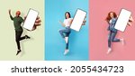 Small photo of Happy emotional successful international people expressive emotions of joy, show smartphone with empty screen, isolated on colored background. Advertising, app, huge offer and sale, social networks