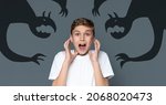Small photo of Screaming Teen Boy Scared Of Shadow Monsters Drawn Around Him, Creative Collage For Phobias And Inner Fears With Terrified Teenage Guy Shouting At Camera, Kid Suffering Nightmare, Panorama