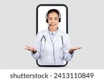 Small photo of Affable european doctor with a headset framed within a smartphone outline, suggesting a friendly telemedicine consultation, ideal for online healthcare services, isolated on gray studio background