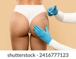 Sculptra Non Surgical Butt Lift. Rear view of young woman getting hip injection at beauty salon, closeup shot of surgeon making injection at buttocks area, isolated on beige studio background