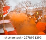 Small photo of Berlin, Germany - March 06, 2023: Warning strike in front of the gates of the Berliner Stadtreinigung with orange smoke and waving flags of the union Ver.di.