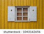 Window With A Yellow Wall