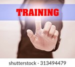 Small photo of business woman touch TRAINING Text