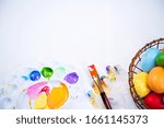 Small photo of Design concept - Preparing for Easter celebration, painting Easter eggs with colorful Acrylic pigment color dyestuff in palette, close up, lifestyle.