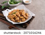 Small photo of Close up of delicious fried popcorn chicken food in Taiwan for famous night market street food delicacy.