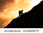 Man climbing up a mountain. 