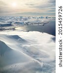 Small photo of The pristine snow covered mountain tops and arctic ocean of Svalbard, a Norwegian archipelago between mainland Norway and the North Pole. This is an unspoiled and largely untouched arctic wilderness.