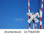 Railroad Crossing Sign Against...