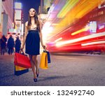 beautiful woman with many shopping bags