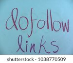 Small photo of Text dofollow links hand written by colorful oil pastels on blue color paper