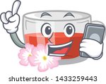 with phone rosehip tea above... | Shutterstock .eps vector #1433259443