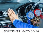 Repairman holding monitor tool to check and fixed car air conditioner system, Technician check car air conditioning system refrigerant recharge, Air Conditioning Repair