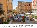 Small photo of Cagliari,Sardinia,Italy 09 September 2021:Carlo Alberto square in the historic center also occupied by some restaurant.