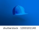 Small photo of Blank cap in perspective view. Blue snapback on blue background. Blank baseball snap back cap for your design. Mock up hat cap for you logo, brand identity etc.