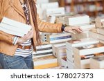 Woman Holding Books At A...