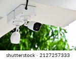 Small photo of Mini ip cctv cameras installed on the wall to store and monitor the situations around areas of the house to do the security and safety at home when the owner is outside, soft and selective focus.