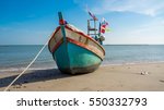 Fishing Boat On The Beach With...