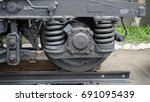 Small photo of Close up picture of a metal wheel of train with amortisation system.