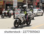 Small photo of Davao City, Philippines - March 18, 2023: Higway Patrol Men, 86th Araw ng Dabaw Celebration