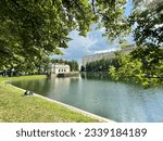 Small photo of Moscow, Russia, Ju 12, 2023. People relax on the shore of the Patriarch's Pond in Moscow in the summer