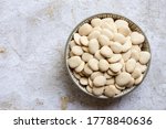 Uncooked lima beans in a bowl