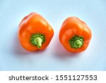 Small Bell Peppers. Two Orange...