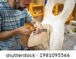 Caucasian Man Making A Wooden...