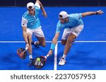 Small photo of Italy, Milan, dec 10 2022: Alejandro Galan (esp) right hand low volley in the second set during A. Galan-J. Lebron vs F. Belasteguin-A. Coello, SF Milano Premier Padel P1 at Allianz Cloud