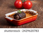 Small photo of german meat roulade in a casserole