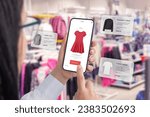 Small photo of Clothes shop through a smartphone app with balloons arround suggesting clothing recommendations