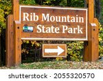 Rib Mountain State Park sign pointing to Park Road headed for Granite Peak ski area in Wausau, Wisconsin, horizontal