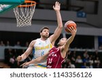 Small photo of KYIV, UKRAINE - JULY 1, 2018: Block shot dramatic effort by Viacheslav Kravtsov. Amazing spectacular layup in low post by Janis Strelnieks. FIBA World Cup 2019 European Qualifiers match Ukraine-Latvia