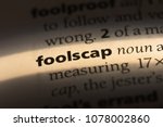 Small photo of foolscap word in a dictionary. foolscap concept