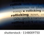 Small photo of rollicking word in a dictionary. rollicking concept.
