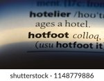 Small photo of hotfoot word in a dictionary. hotfoot concept.