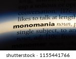 Small photo of monomania word in a dictionary. monomania concept.