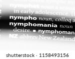 Small photo of nymphomania word in a dictionary. nymphomania concept.