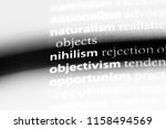Small photo of nihilism word in a dictionary. nihilism concept.