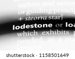 Small photo of lodestone word in a dictionary. lodestone concept.