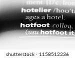 Small photo of hotfoot word in a dictionary. hotfoot concept.